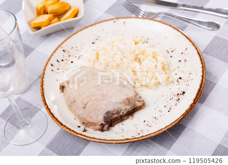 Seared tuna steak served with boiled white rice 119505426