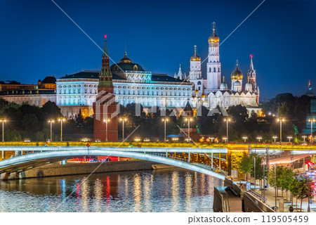 Illuminated Moscow Kremlin and Bolshoy Kamenny Bridge at summer night. View from the Patriarshy pedestrian Bridge 119505459