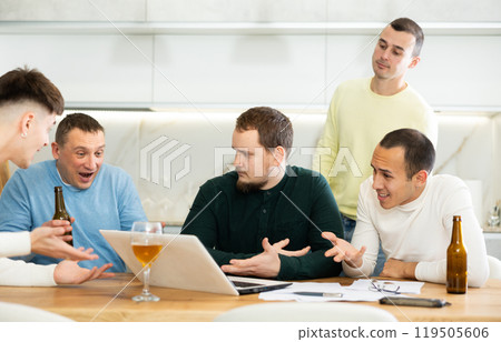 Group of men comforting distressed friend at computer at home 119505606