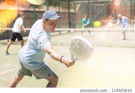 Adult and young men playing padel against two men Adult and young men playing padel against two men 119505614