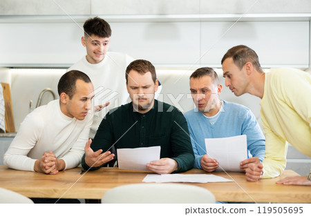 Friends consoling upset worried man reading unexpected medical results Friends consoling upset worried man reading unexpected medical results 119505695