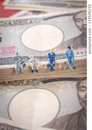 Money and miniature men and women business image 119506256