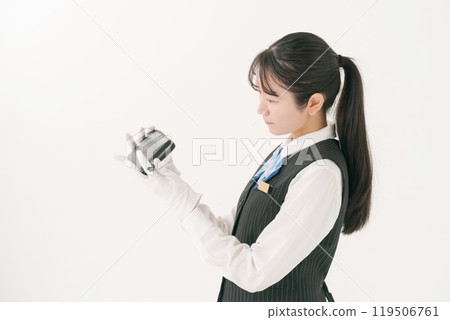 Woman appraising a wallet 119506761