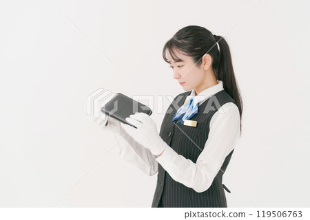 Woman appraising a wallet 119506763