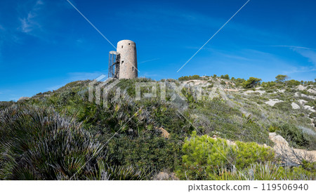 Ancient watchtower overlooking a Mediterranean landscape 119506940