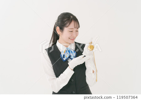 A female staff member appraising precious metals A female staff member appraising precious metals 119507364