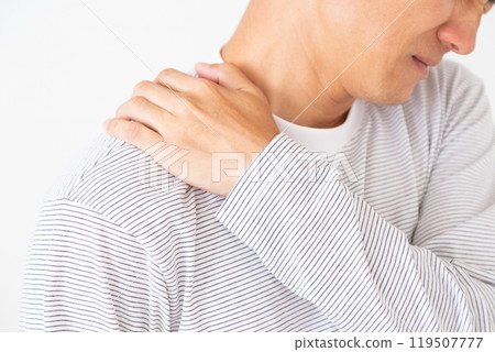 Middle-aged man suffering from stiff shoulders Middle-aged man suffering from stiff shoulders 119507777