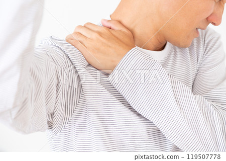 Middle-aged man suffering from stiff shoulders 119507778