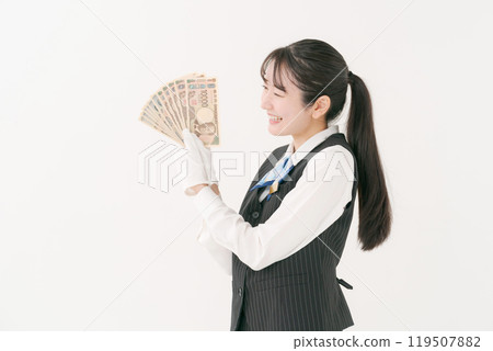 Woman in white gloves holding cash Woman in white gloves holding cash 119507882