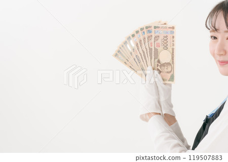 Woman in white gloves holding cash Woman in white gloves holding cash 119507883