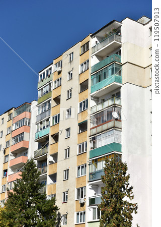 Typical facade of concrete panel building. Post Soviet flat of blocks 119507913