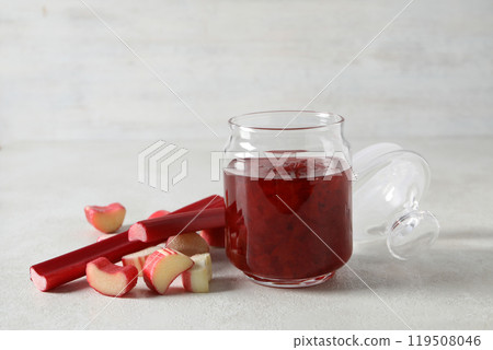 Rhubarb jelly in a jar with fresh rhubarb stems 119508046