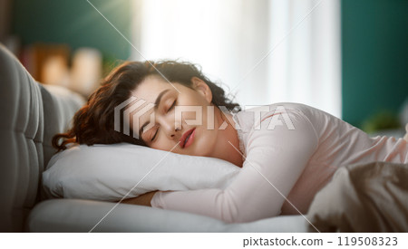 woman is sleeping in the bedroom 119508323