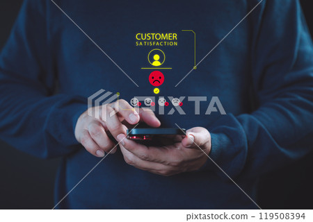 Man use a mobile phone give angry emotion face on virtual screen for feedback review satisfaction service opinion and testimonial on application. Online customer review satisfaction feedback survey. Man use a mobile phone give angry emotion face on virtual screen for feedback review satisfaction service opinion and testimonial on application. Online customer review satisfaction feedback survey. 119508394