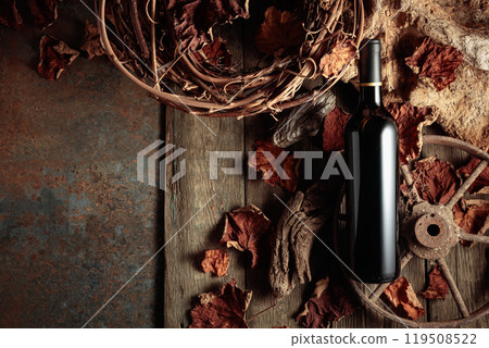 Bottle of red wine on a vintage rustic background. Bottle of red wine on a vintage rustic background. 119508522