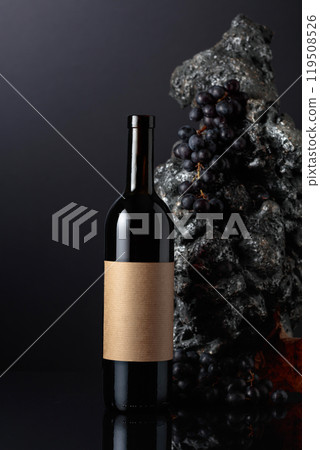 Bottle of red wine with empty label. 119508526