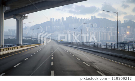 Road, bathed in the soft luminescence of streetlights, leads directly to the capital city Road, bathed in the soft luminescence of streetlights, leads directly to the capital city 119509212