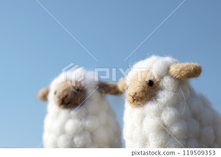 Blue sky and two wool felt sheep Blue sky and two wool felt sheep 119509353