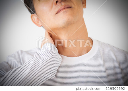 Middle-aged man suffering from neck pain Middle-aged man suffering from neck pain 119509692