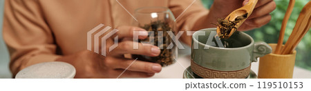 Man Brewing Herbal Tea At Home Man Brewing Herbal Tea At Home 119510153