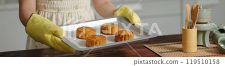 Woman Baking Moon Cakes At Home 119510158