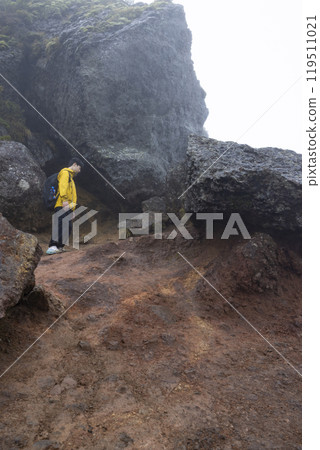 A boy climbing a mountain 119511021