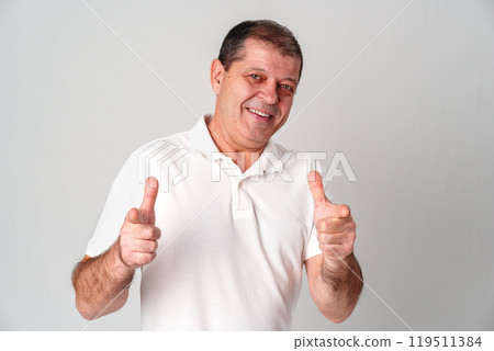 An older man smiling and reaching out with both hands An older man smiling and reaching out with both hands 119511384