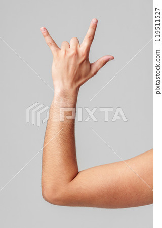 A person hand gesture against a neutral background 119511527