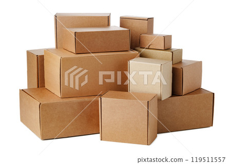 Stacked brown cardboard boxes in various sizes arranged on a white background 119511557