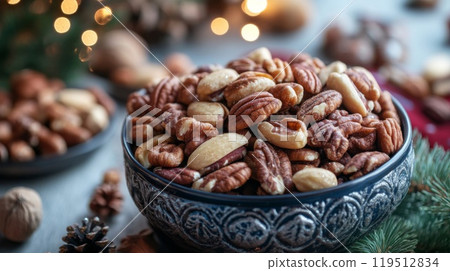 A Close-Up of Pecans and Other Nuts in a Decorative Bowl 119512834
