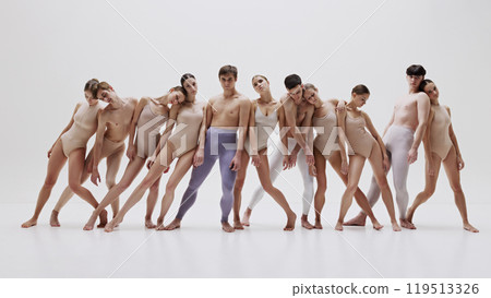 Contemporary ballet group in synchronized pose against light background. Contemporary ballet group in synchronized pose against light background. 119513326