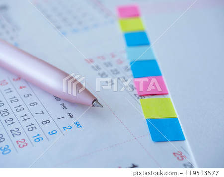 Calendar and documents on the table 119513577