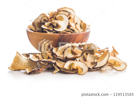 Dried porcini mushrooms. Sliced boletus in bowl isolated on white background. 119513585