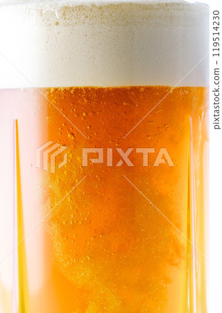 Cold delicious beer poured into a glass Cold delicious beer poured into a glass 119514230