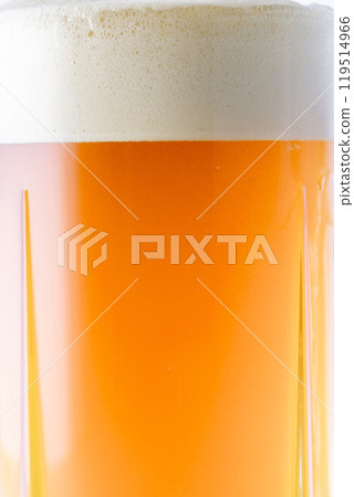 Cold delicious beer poured into a glass 119514966