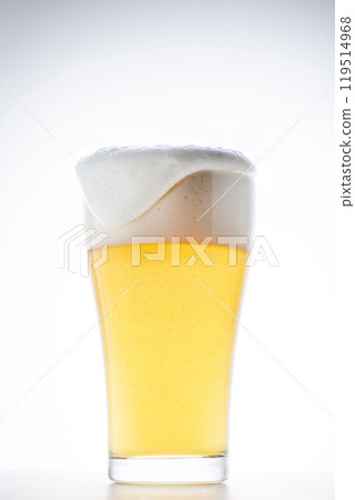 Cold delicious beer poured into a glass Cold delicious beer poured into a glass 119514968