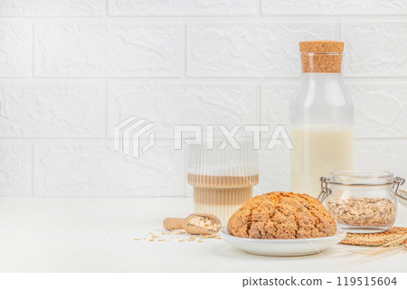 Homemade gluten free oatmeal cookies with with a glass of latte on a light background, copy space 119515604