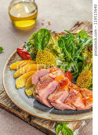 Roast duck breast with orange and greens. copy space, top view 119515640