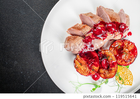 Baked duck fillet with plums and cranberry sauce, Thanksgiving dinner, cookbook recipe top view 119515641
