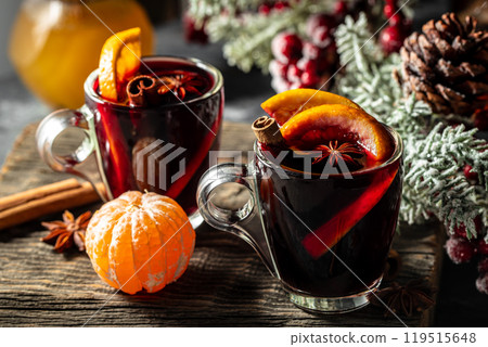 Christmas mulled wine with spices and oranges, festive cocktail Christmas mulled wine with spices and oranges, festive cocktail 119515648