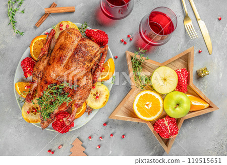 Christmas Dinner. Roasted duck with oranges, berries and herbs. top view 119515651