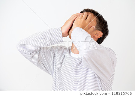 A middle-aged man suffering from anxiety 119515766
