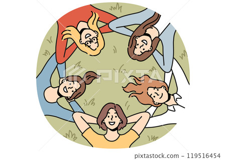 Group of girls lies on grass and looks up smiling enjoying vacation in park in hot summer weather Group of girls lies on grass and looks up smiling enjoying vacation in park in hot summer weather 119516454