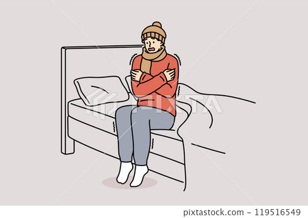 Freezing man is shaking sitting on bed and feeling chills and cold, dressed in hat and scarf Freezing man is shaking sitting on bed and feeling chills and cold, dressed in hat and scarf 119516549