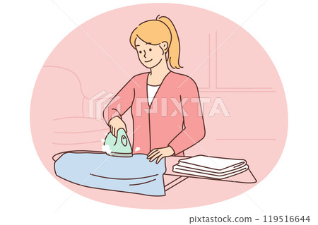Woman ironing clothes on an ironing board 119516644