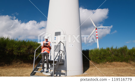 Senior engineer under wind turbine  119516779