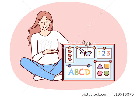 Woman english teacher in elementary school with magnetic board with multi-colored alphabet Woman english teacher in elementary school with magnetic board with multi-colored alphabet 119516870