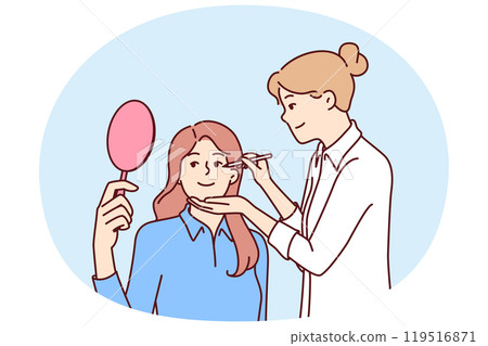 Woman beautician makes make-up of patient with mirror undergoing aesthetic treatment Woman beautician makes make-up of patient with mirror undergoing aesthetic treatment 119516871