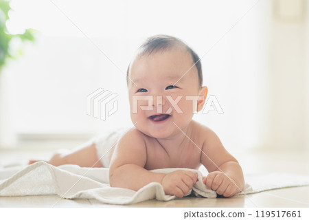 Baby lying on the windowsill Baby lying on the windowsill 119517661