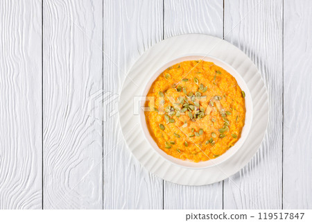 butternut squash puree with pumpkin seeds in bowl butternut squash puree with pumpkin seeds in bowl 119517847